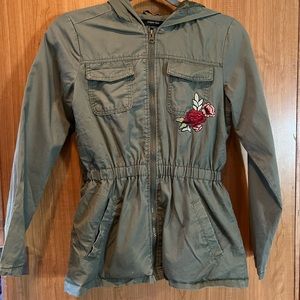 Paper Tee girls size 14 zip up green jacket with a hood.